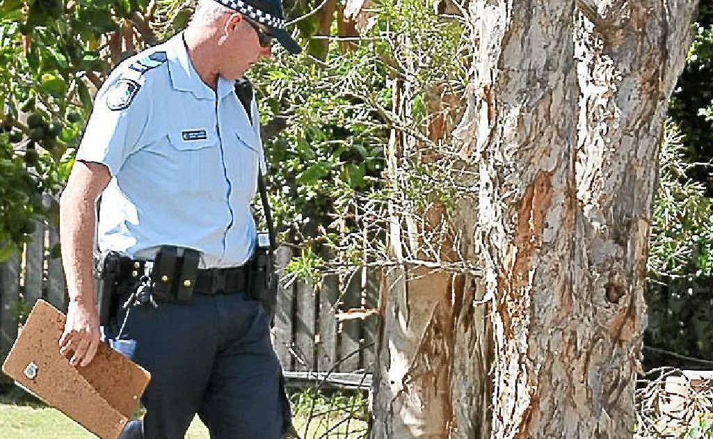 Police inspect the bomb. Police inspect the bomb.
